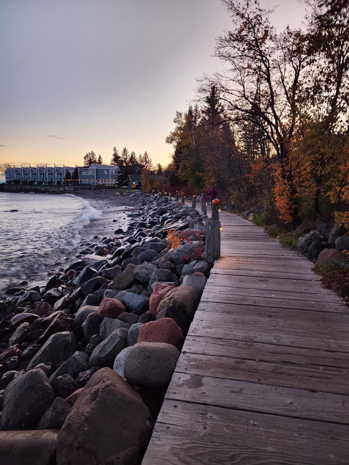 Wooden shoreline boardwalk beside Lake Superior at dusk
